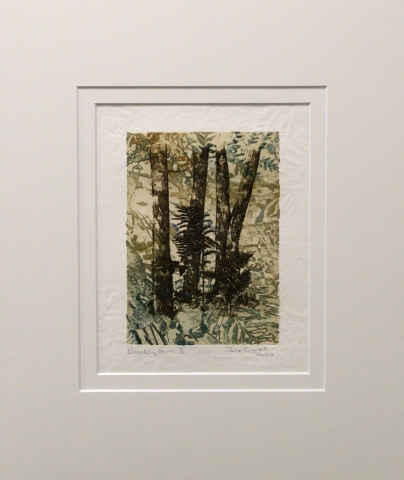 Unframed artwork by Julie Bignell of bracken fern amongst tree trunks