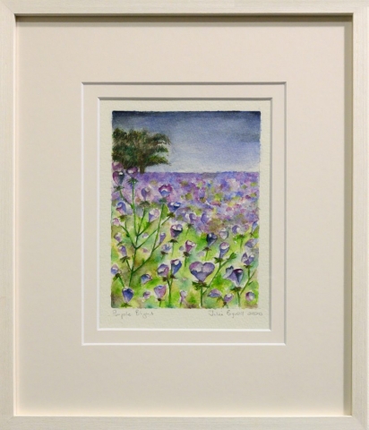 Framed artwork by Julie Bignell of purple flowers in the foreground with a field of green and purple in the background and a tree