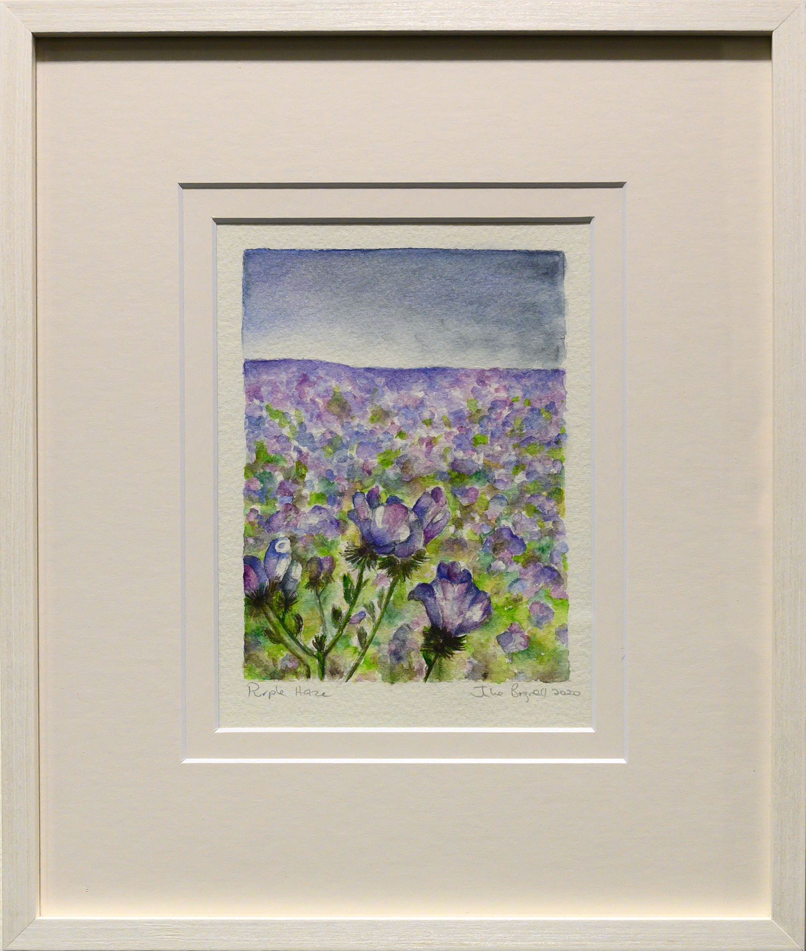 Framed artwork by Julie Bignell of purple flowers in the foreground with a field of purple flowers in the background and blue sky