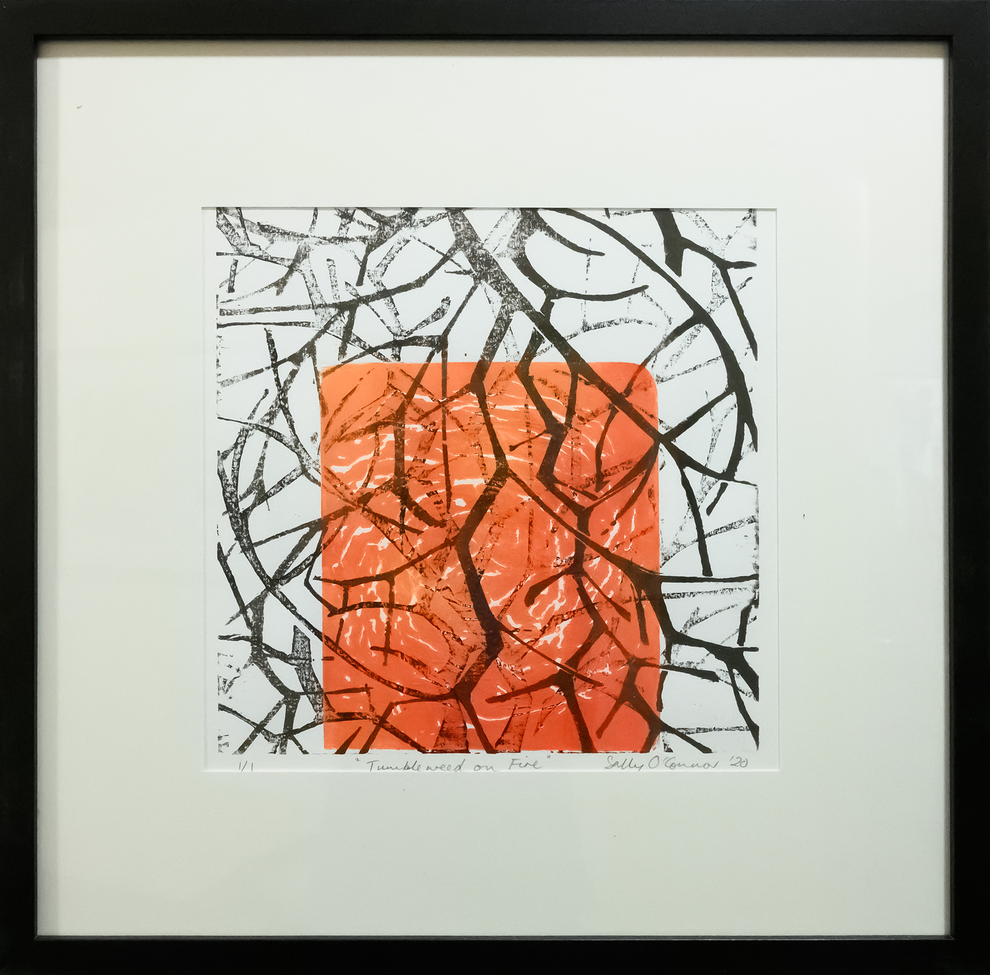 Framed artwork by Sally OConnor of layers of closeup black tumbleweed branches on a orange/red background