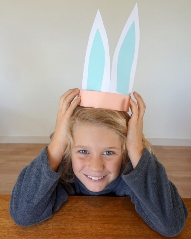 Boy wearing finished set of bunny ears showing alternate decorations.